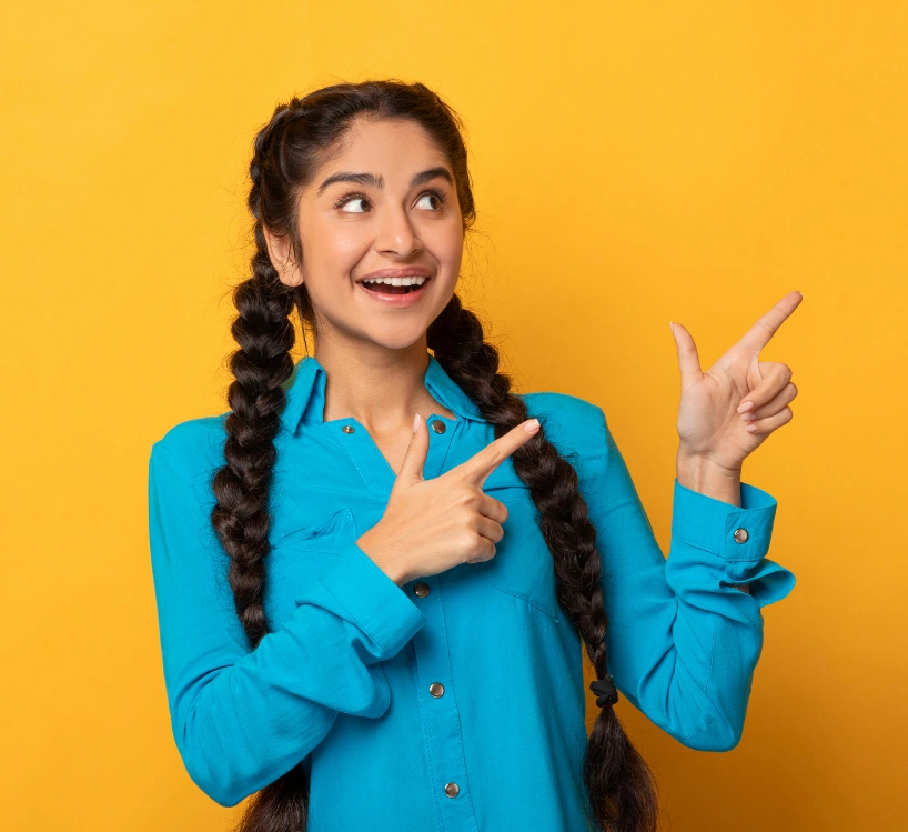 Happy young woman pointing towards information about getting guidance from a professional astrology consultant